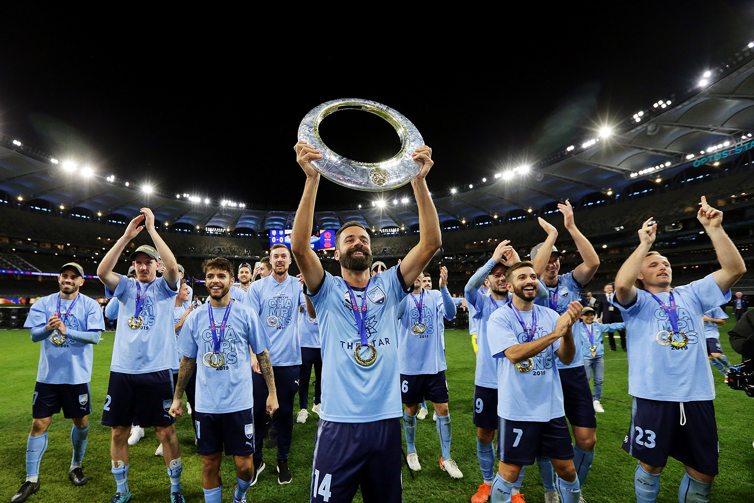 Brosque lifts the trophy