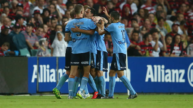 Sydney FC players celebrate their equaliser against the Wanderers at Allianz Stadium.