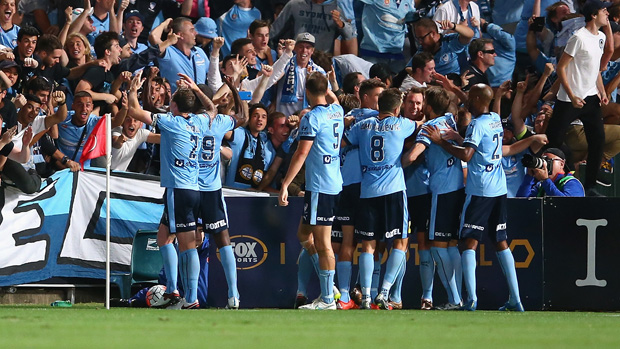 Sydney FC players celebrate Shane Smeltz's late winner against the Wanderers.